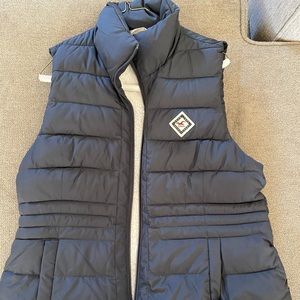 Sherpa-Lined Puffer Vest.